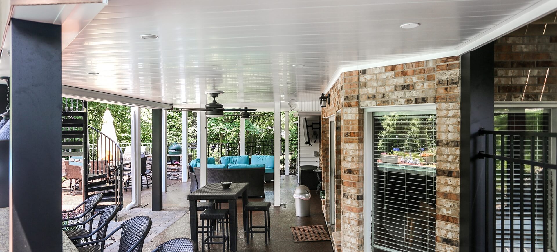 white gloss under deck ceiling with matching molding wrapping around angled walls of home