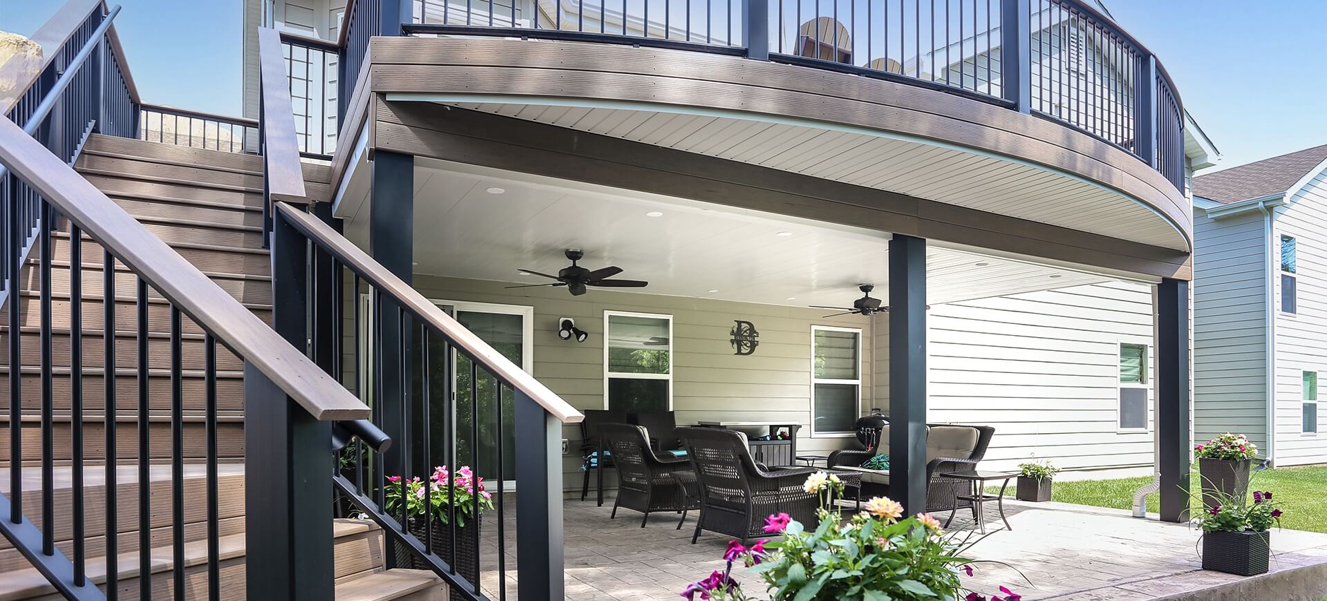 white gloss under deck ceiling with two ceiling fans